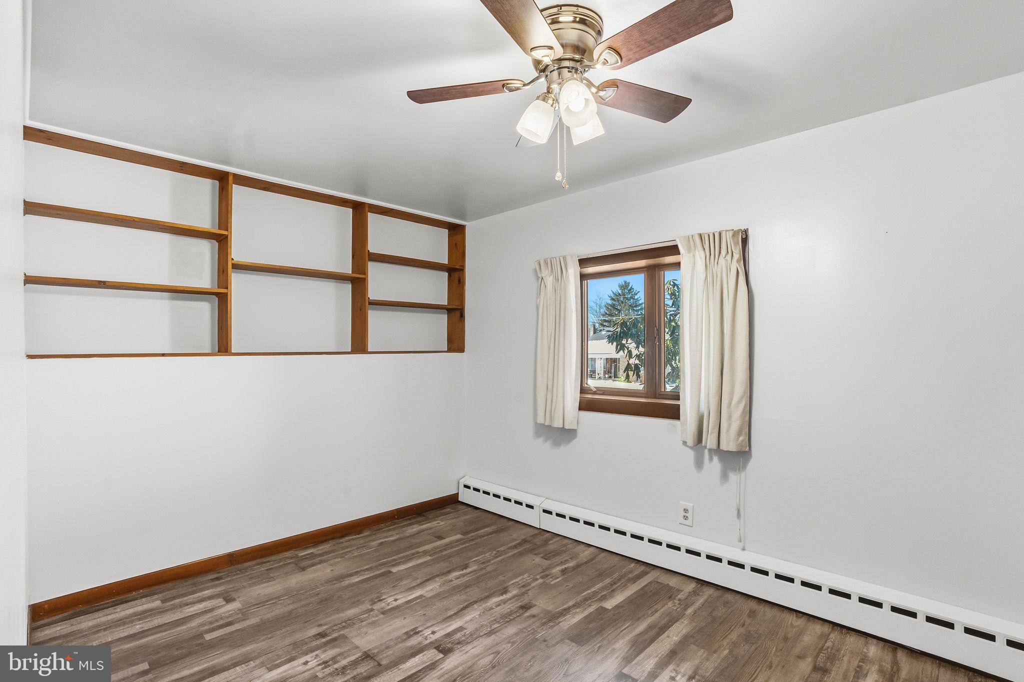 610 East Market Street Beavertown, PA 17813 - Photo 26 of 46 a view of an empty room with a window and wooden floor