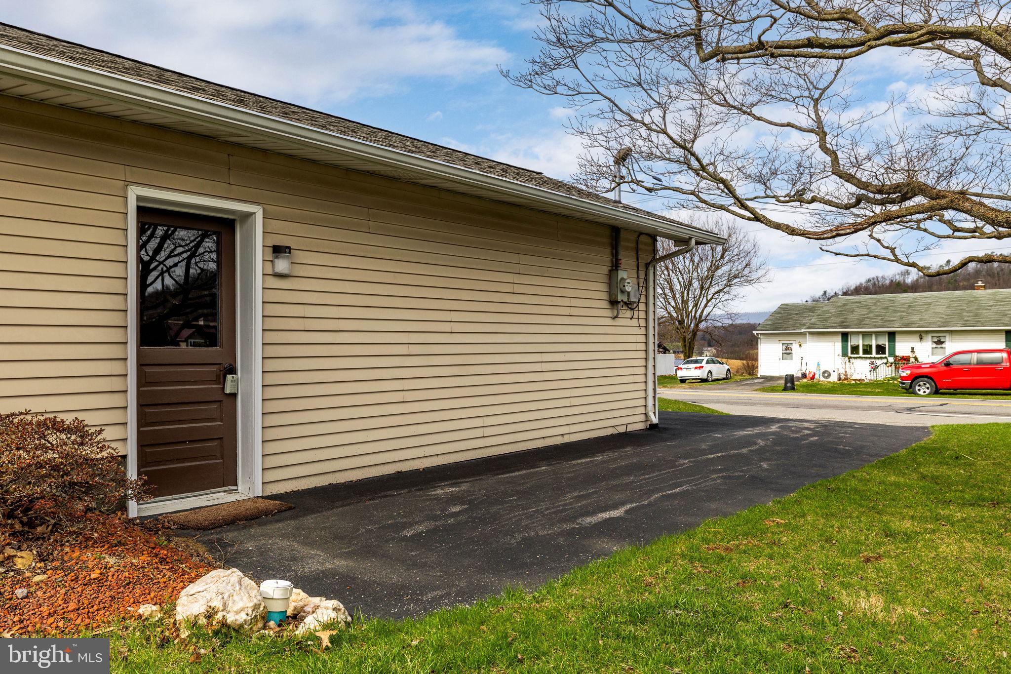 610 East Market Street Beavertown, PA 17813 - Photo 36 of 46 a view of a house with a yard