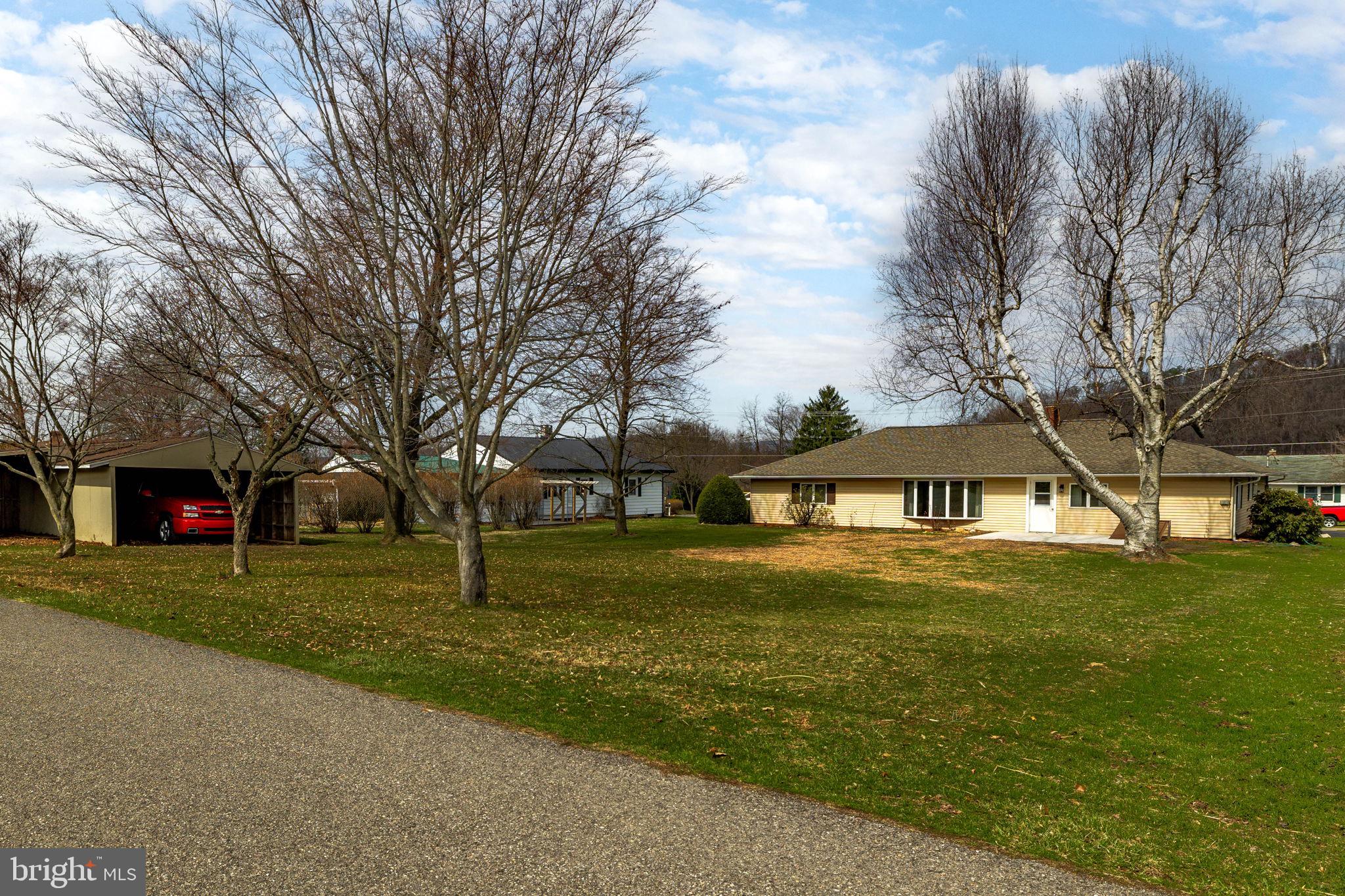 610 East Market Street Beavertown, PA 17813 - Photo 40 of 46 a front view of a house with a yard
