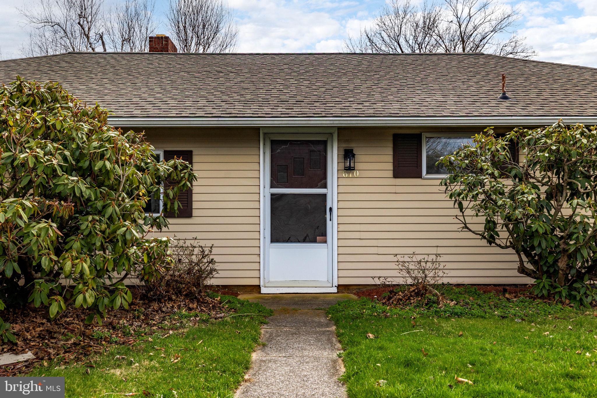 610 East Market Street Beavertown, PA 17813 - Photo 41 of 46 a front view of a house with garden