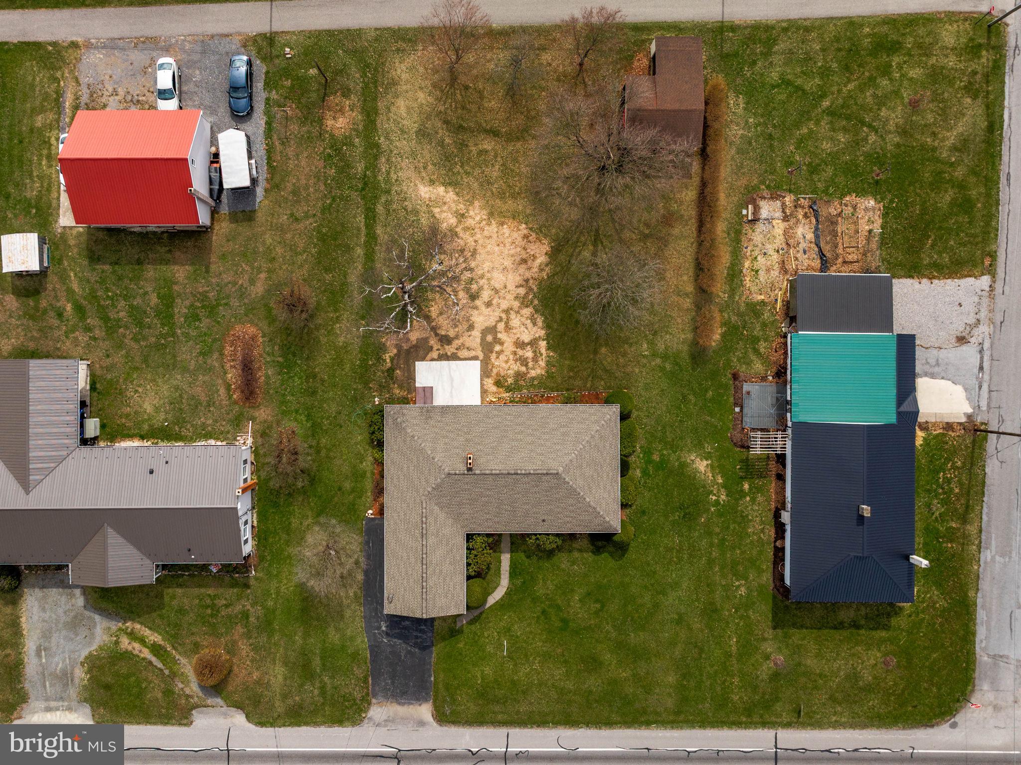 610 East Market Street Beavertown, PA 17813 - Photo 42 of 46 an aerial view of residential houses with outdoor space and parking