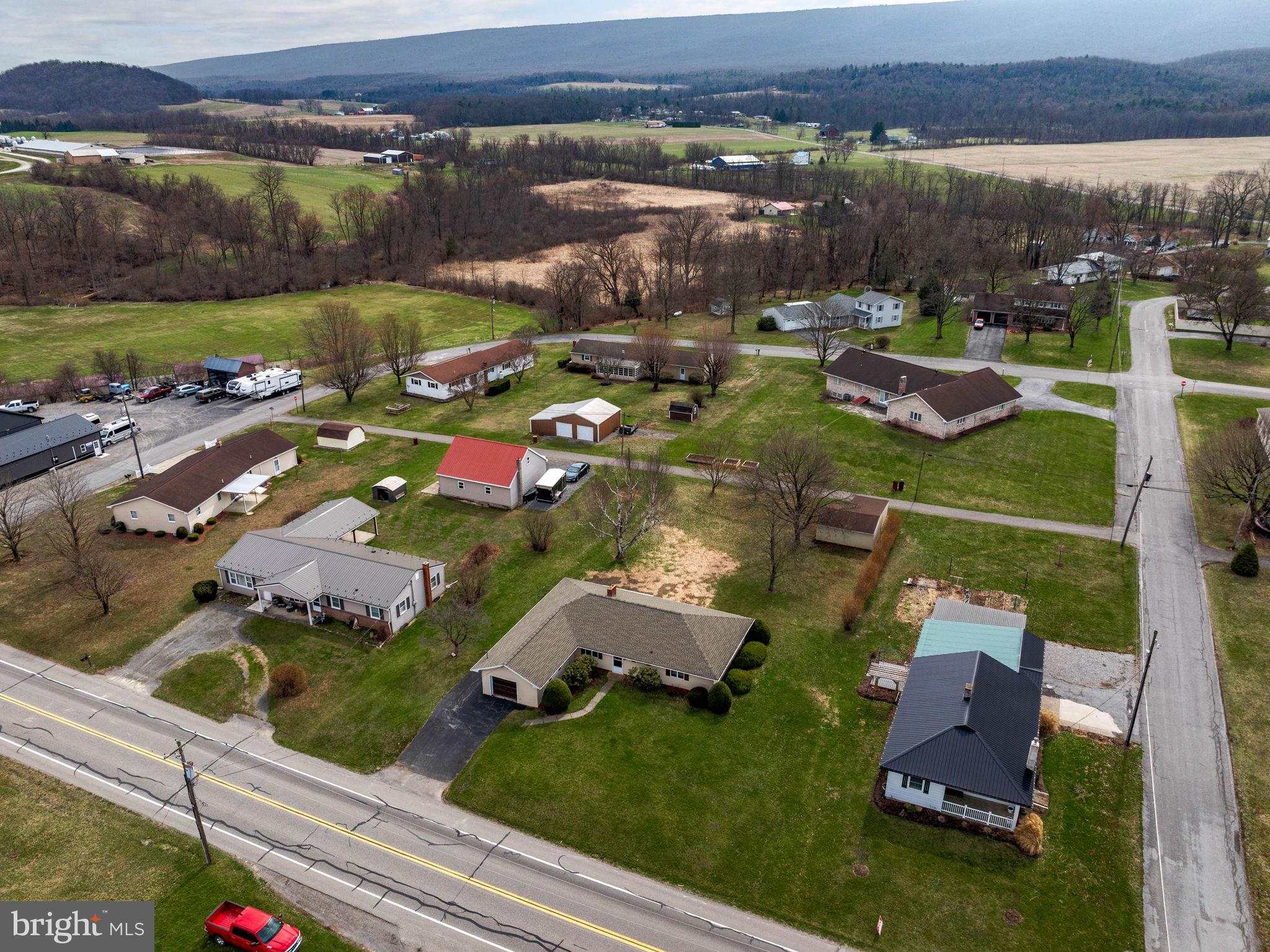 610 East Market Street Beavertown, PA 17813 - Photo 44 of 46 an aerial view of residential houses with outdoor space and lake view