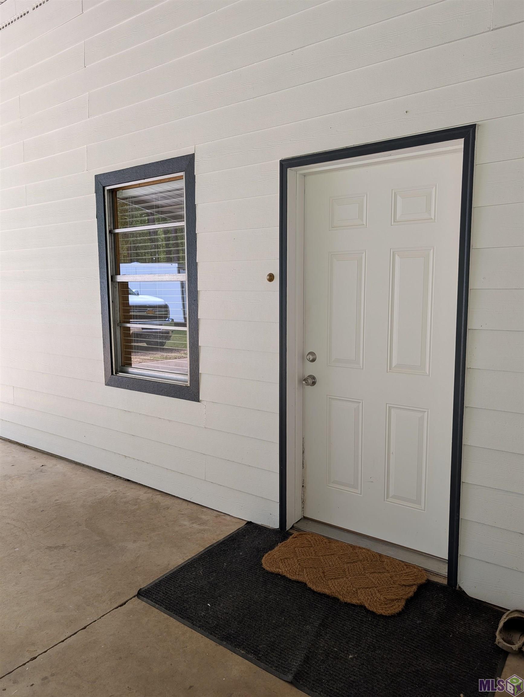 4855 Highway 952 Jackson, LA 70748 - Photo 21 of 34 Covered Entrance Under Carport