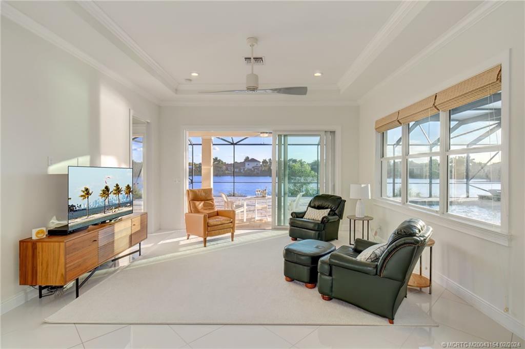 7172 Southeast Pierre Circle Stuart, FL 34997 - Photo 16 of 43 a living room with furniture and a large window