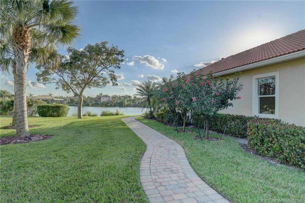 7172 Southeast Pierre Circle Stuart, FL 34997 - Photo 31 of 43 a view of a house with a yard