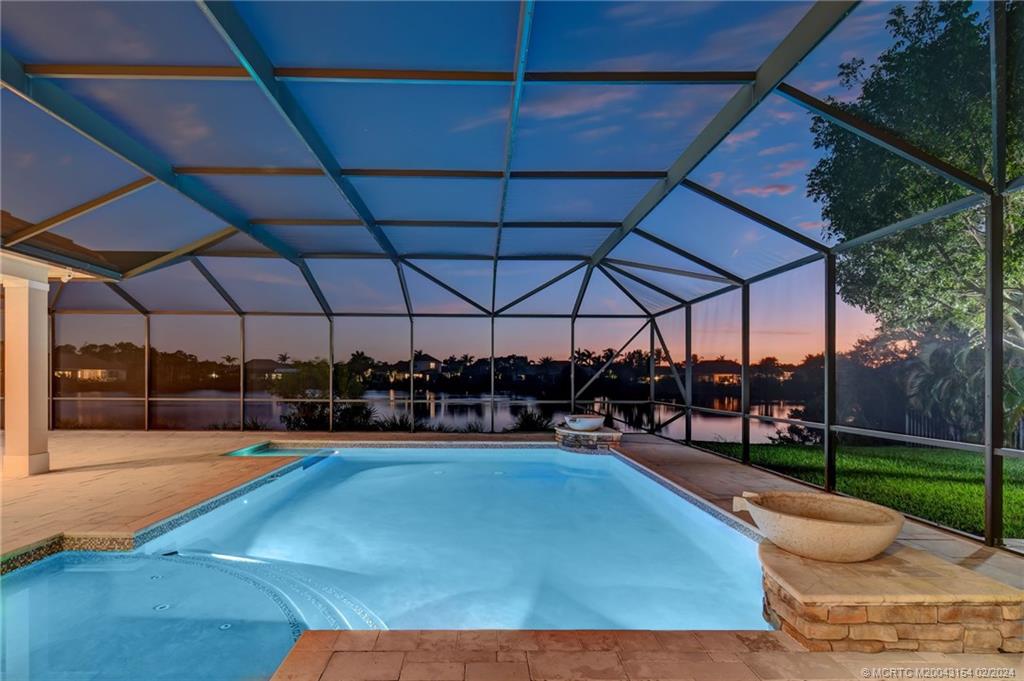 7172 Southeast Pierre Circle Stuart, FL 34997 - Photo 35 of 43 a view of a swimming pool with a patio