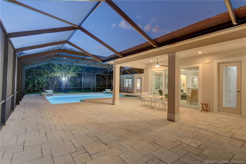 7172 Southeast Pierre Circle Stuart, FL 34997 - Photo 36 of 43 a view of a room with table and chairs