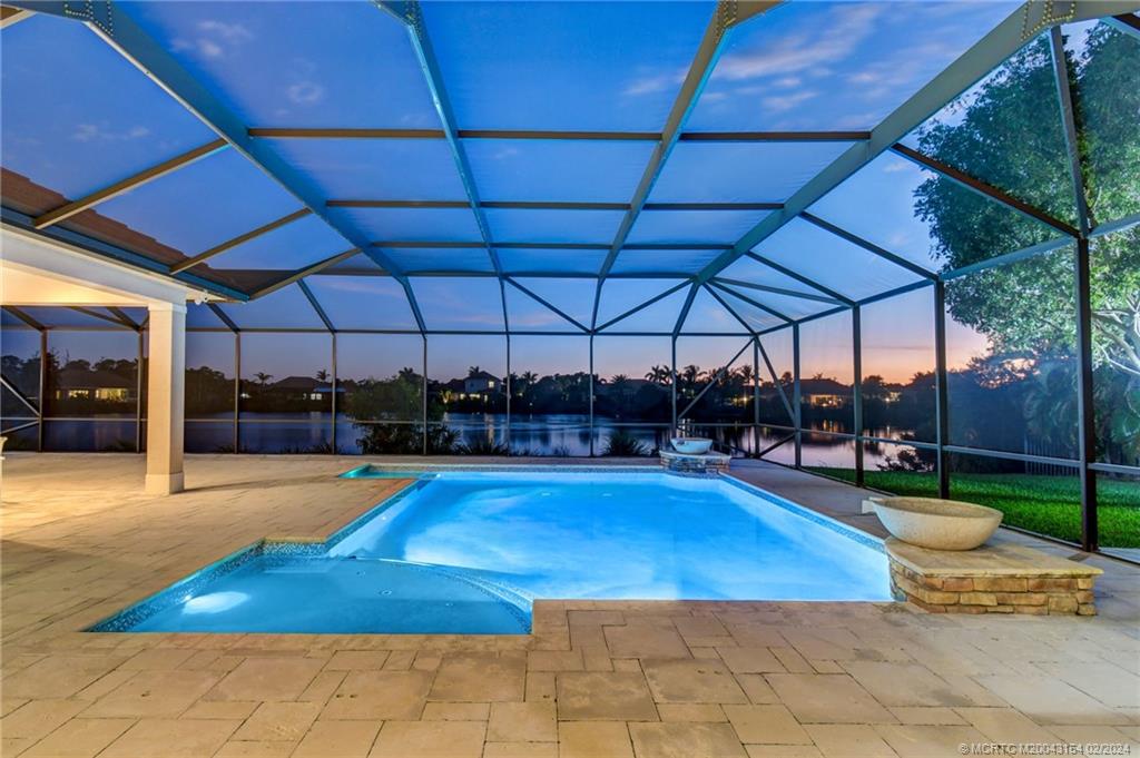 7172 Southeast Pierre Circle Stuart, FL 34997 - Photo 38 of 43 a view of a swimming pool with a patio