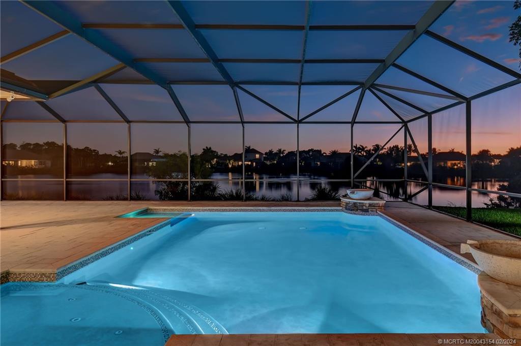 7172 Southeast Pierre Circle Stuart, FL 34997 - Photo 39 of 43 a view of a swimming pool with sitting area