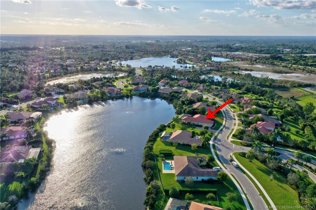 7172 Southeast Pierre Circle Stuart, FL 34997 - Photo 4 of 43 an aerial view of residential houses with outdoor space and trees