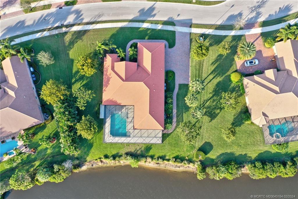 7172 Southeast Pierre Circle Stuart, FL 34997 - Photo 42 of 43 an aerial view of a house having outdoor space