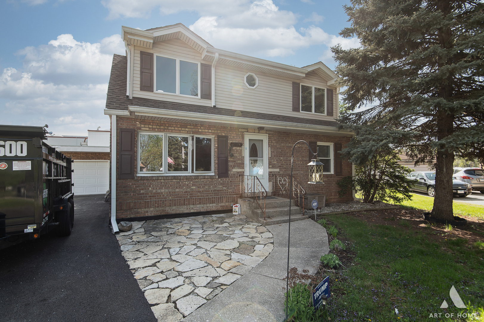 a front view of a house with a yard