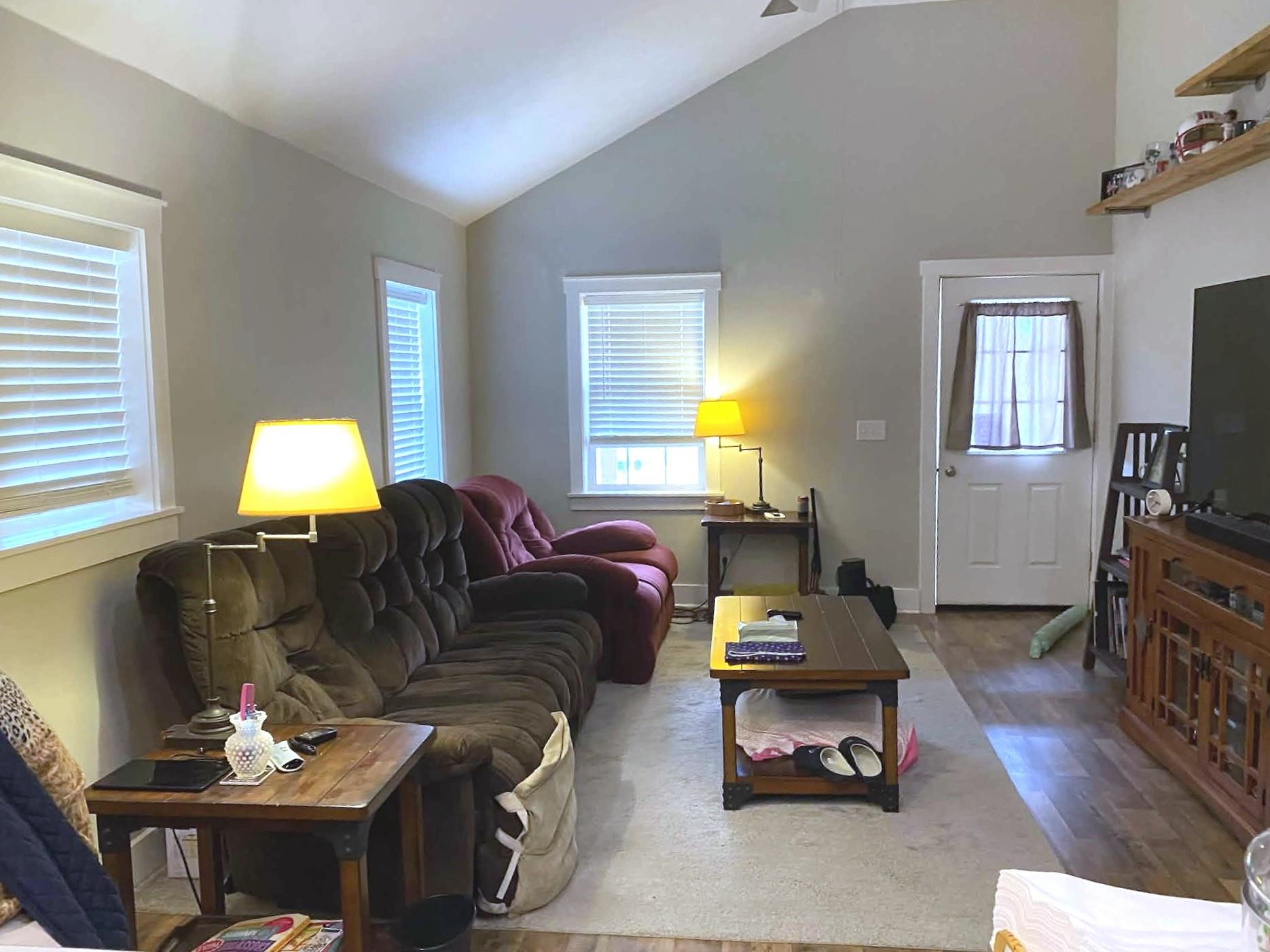 67 Cr 306 Road Iuka, MS 38852 - Photo 5 of 23 Living room featuring lofted ceiling, wood finished floors, and a ceiling fan