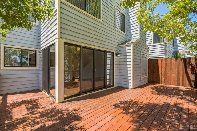 a view of a backyard with a large tree