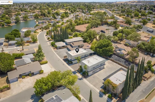 an aerial view of residential houses with outdoor space