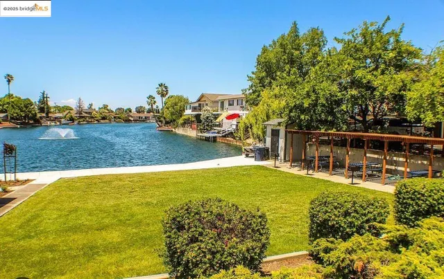 a view of a swimming pool with an outdoor seating and yard