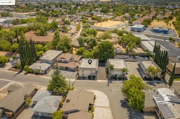an aerial view of residential houses with outdoor space