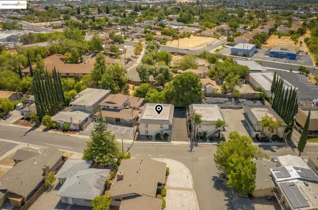 an aerial view of residential houses with outdoor space