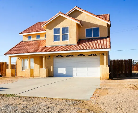 a front view of a house with a garage