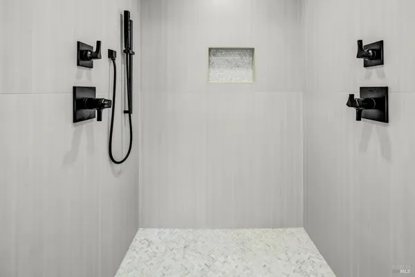 a dining room with table and chairs