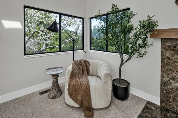 a view of a patio with a table and chairs