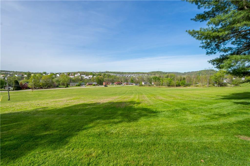 571 West McMurray Road Canonsburg, PA 15317 - Photo 45 of 47 A stunning view of the property's sprawling, level acreage. This massive expanse of lush green lawn offers a rare sense of privacy and endless possibilities for outdoor recreation, equestrian use, or future development.