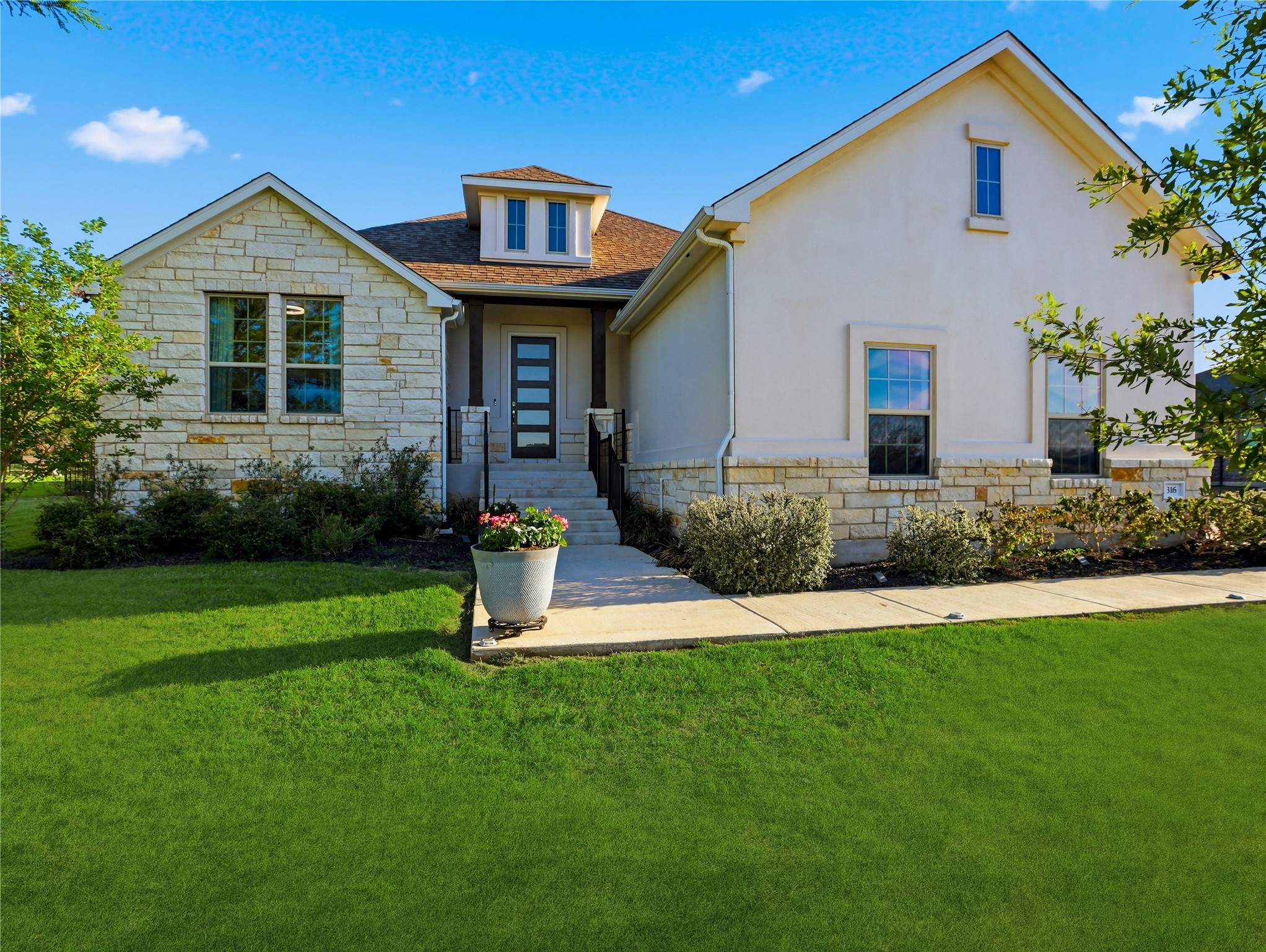 316 Raptor Beak Way Cedar Creek, TX 78612 - Photo 8 of 30 a front view of a house with a yard and porch