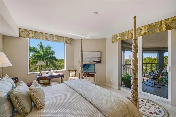 a bedroom with furniture a bed and a window