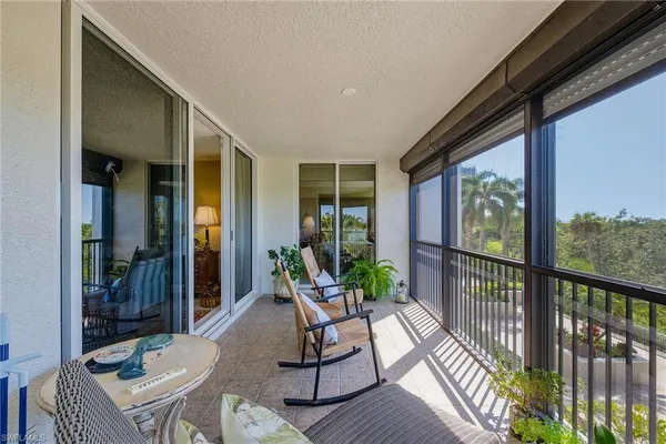 a view of balcony with furniture