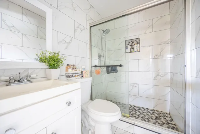 a bedroom with a bed and a dresser