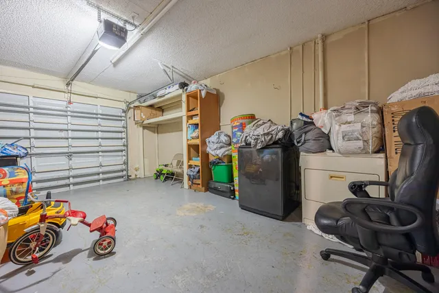 a view of house with a backyard