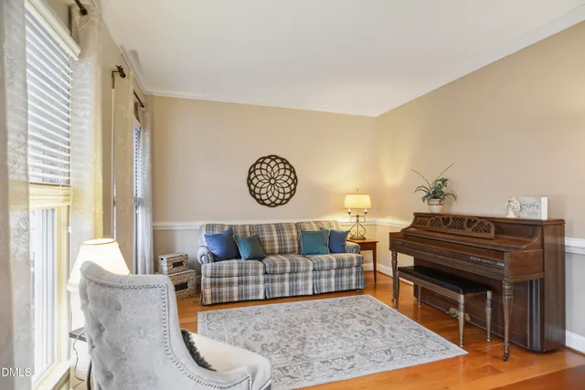 a living room with furniture and a rug