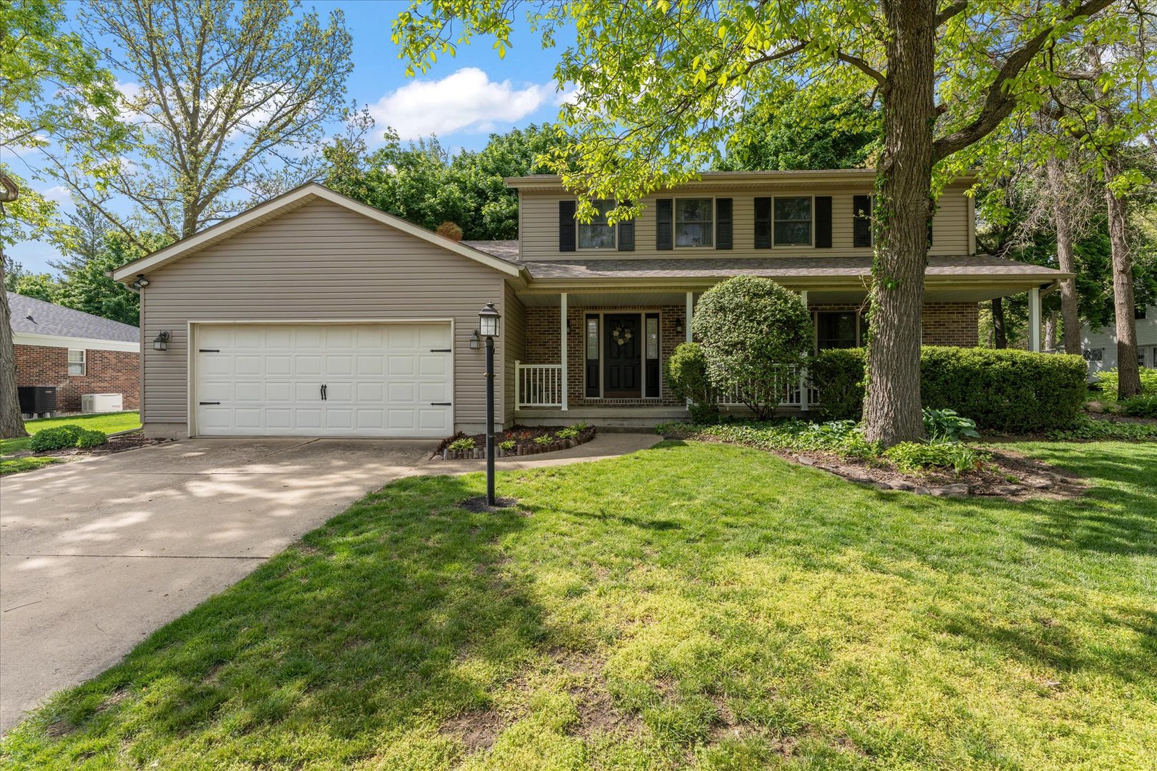789 County Farm Road Monticello, IL 61856 - Photo 1 of 36 a house that has a tree in front of it