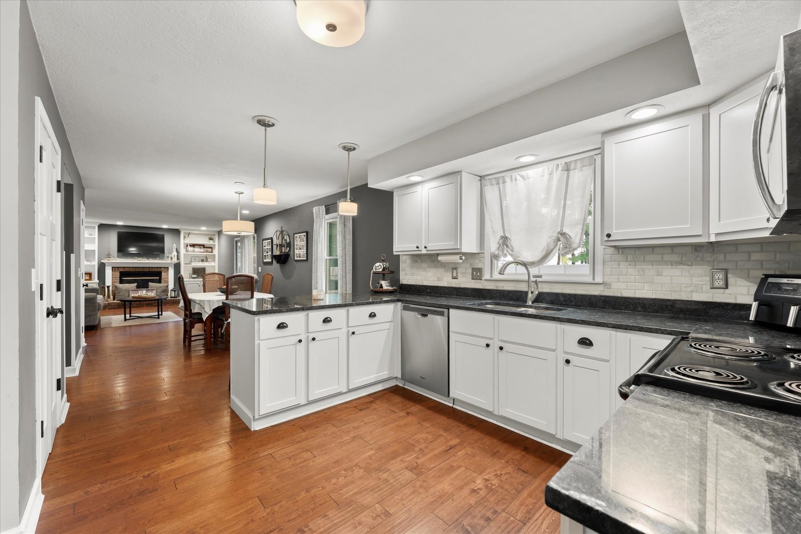 789 County Farm Road Monticello, IL 61856 - Photo 13 of 36 a open kitchen with stainless steel appliances granite countertop a stove refrigerator and cabinets