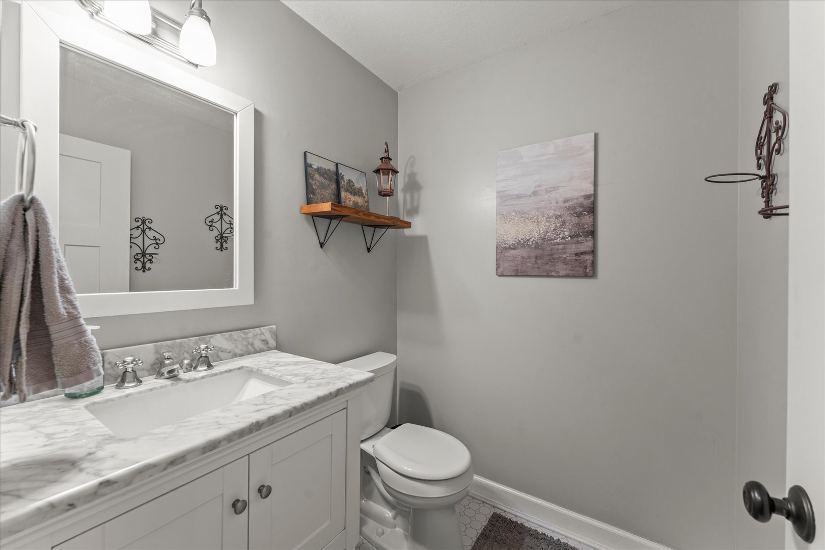 789 County Farm Road Monticello, IL 61856 - Photo 19 of 36 a bathroom with a granite countertop sink mirror vanity and toilet