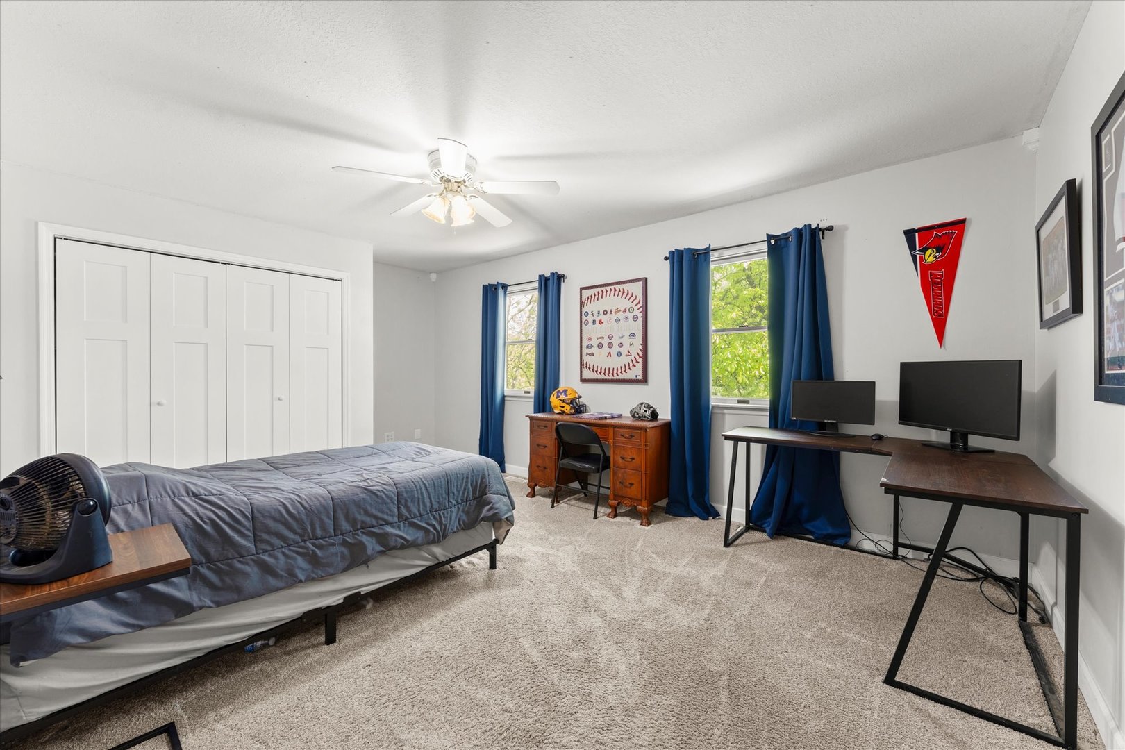 789 County Farm Road Monticello, IL 61856 - Photo 23 of 36 a bedroom with a bed and a chandelier
