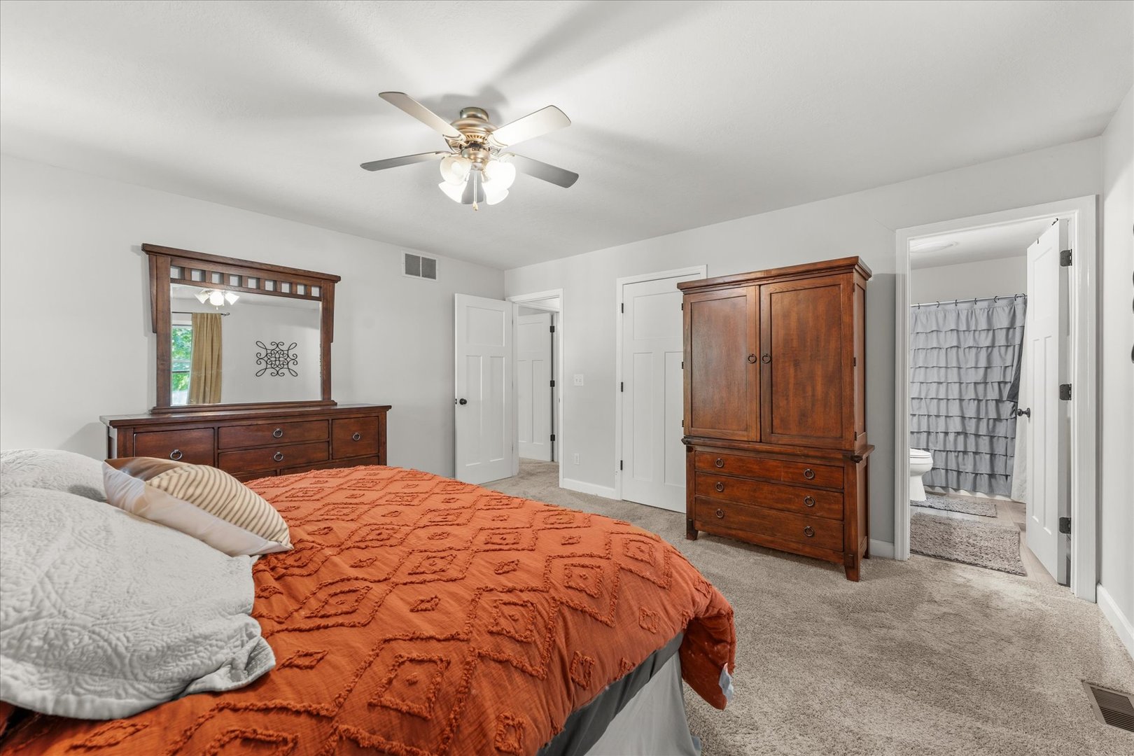 789 County Farm Road Monticello, IL 61856 - Photo 26 of 36 a bedroom with a large bed and a chandelier
