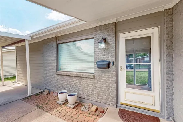 a bathroom with a window and a shower