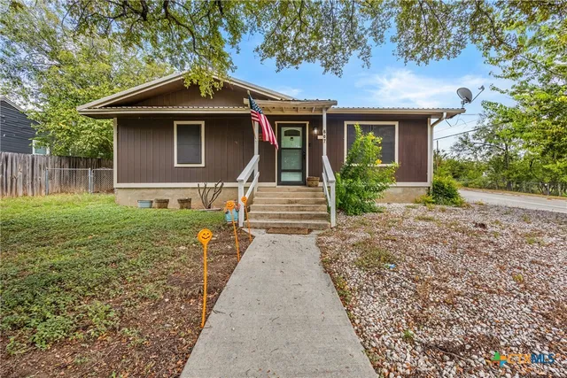 a front view of a house with yard
