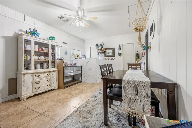 an aerial view of residential house with outdoor space and trees all around