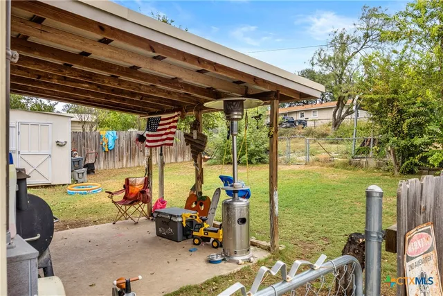 a view of a backyard with a small cabin