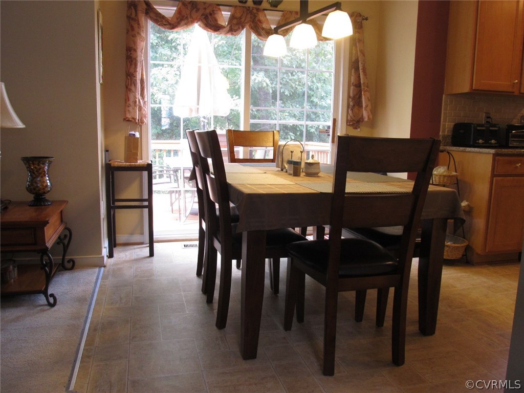 9366 Springmount Terrace Chesterfield, VA 23832 - Photo 4 of 20 a view of a dining room with furniture and a window