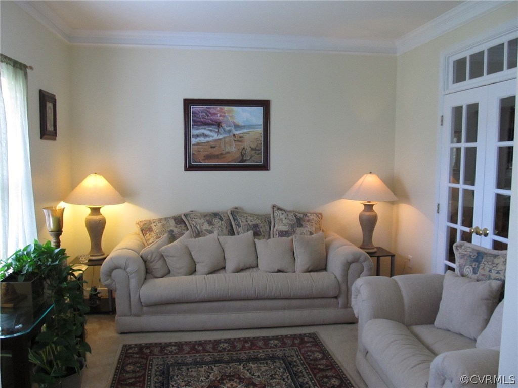 9366 Springmount Terrace Chesterfield, VA 23832 - Photo 7 of 20 a living room with furniture and a lamp