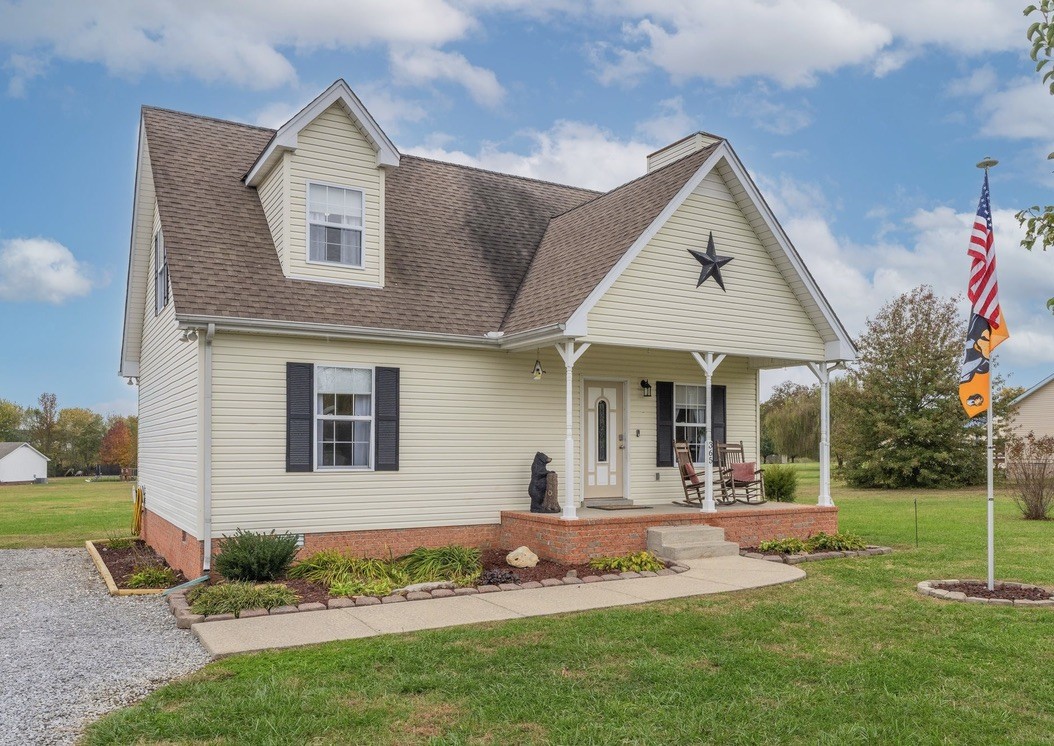 a front view of a house with garden