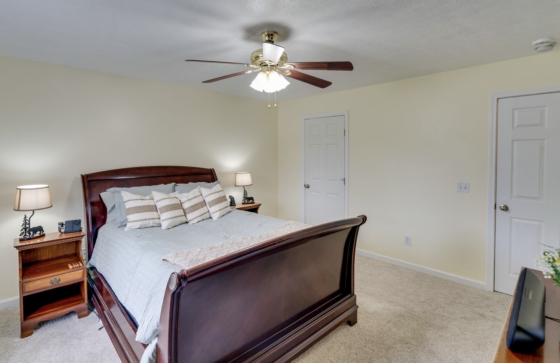 365 Corinth Road Portland, TN 37148 - Photo 11 of 20 a bedroom with a bed and a chandelier