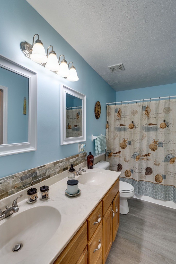 365 Corinth Road Portland, TN 37148 - Photo 12 of 20 a bathroom with double sink and a mirror