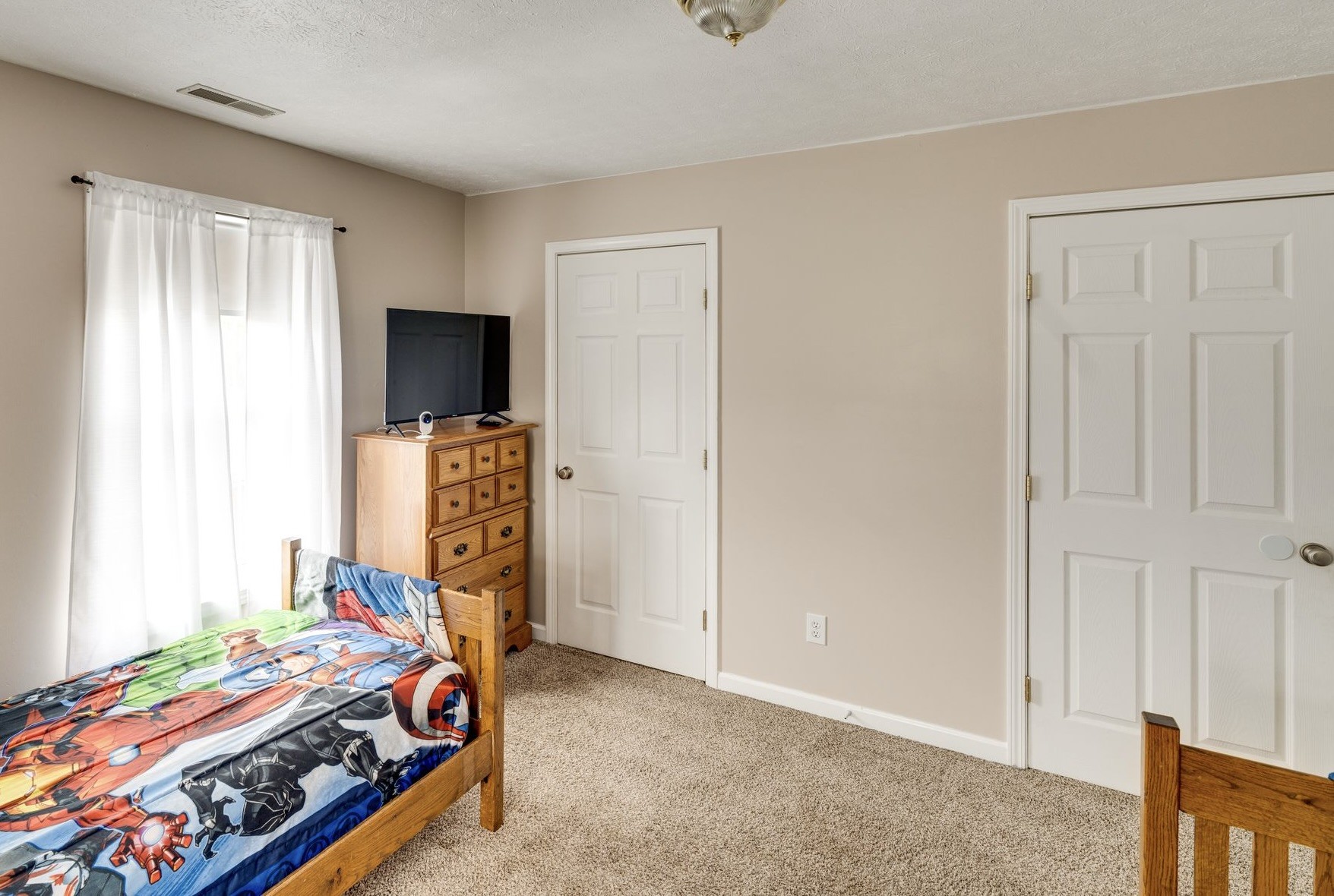 365 Corinth Road Portland, TN 37148 - Photo 17 of 20 a bed room with a bed and a tv