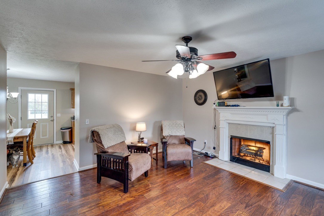 365 Corinth Road Portland, TN 37148 - Photo 5 of 20 a living room with furniture a fireplace and a flat screen tv