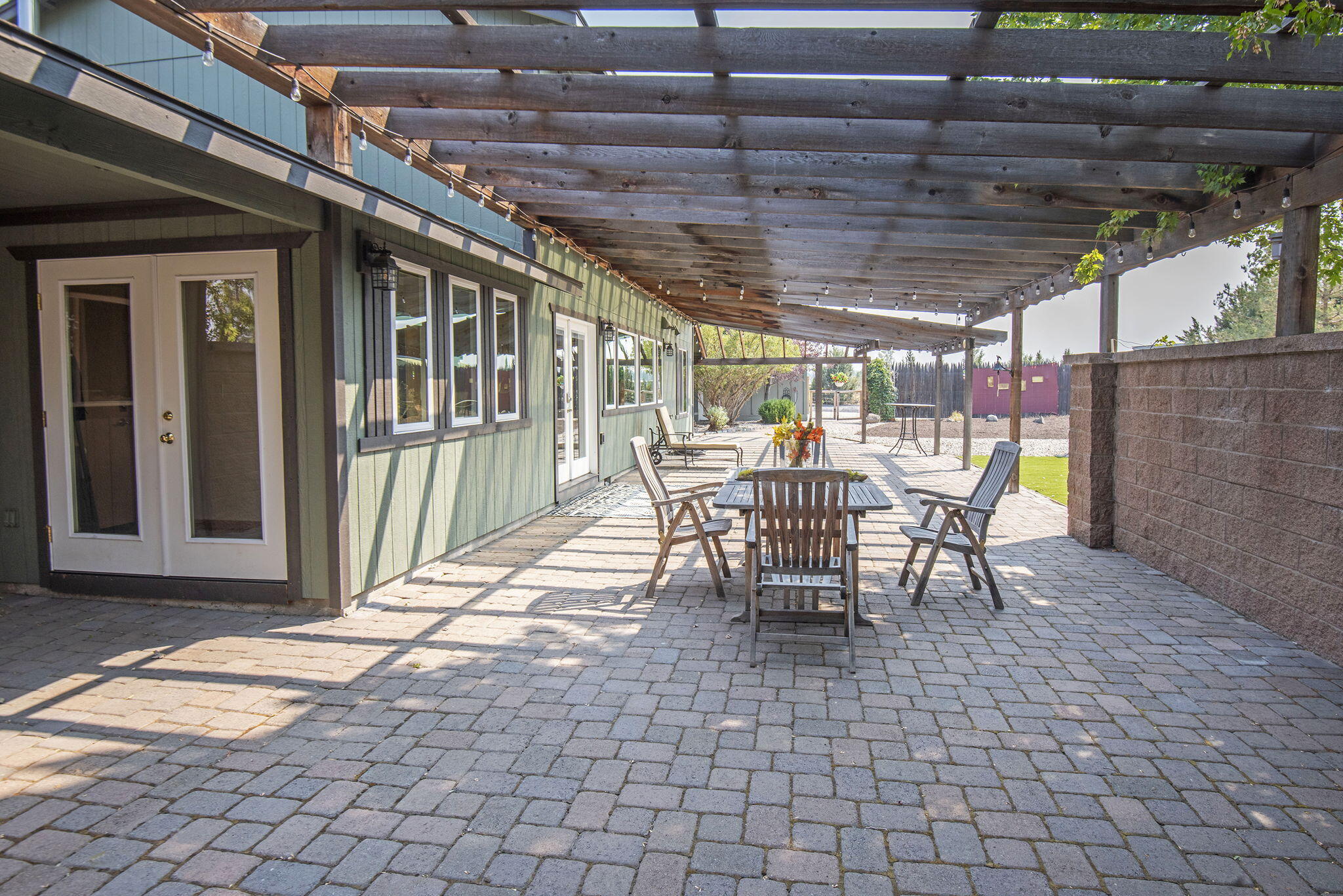 66901 Lance Road Bend, OR 97703 - Photo 48 of 71 a view of a porch with furniture and a yard