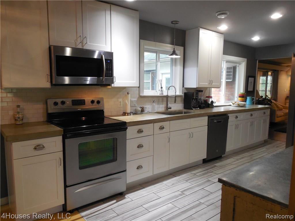 2686 New England Drive Rochester, MI 48309 - Photo 24 of 58 Kitchen - custom cement countertops, subway tile backsplash and porcelain floor